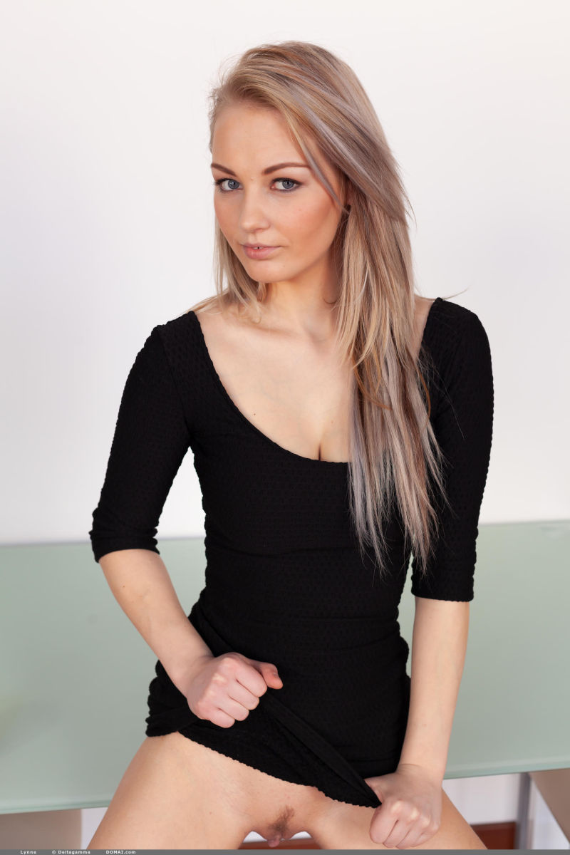 Lynne Firm Blonde in a Black Dress